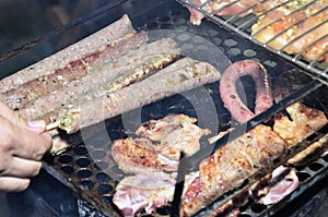 Barbecue grill with kafta, sausages, pork and chicken roasting photo