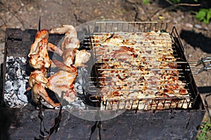 Barbecue grill chicken wings and pork and beef meat
