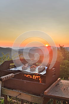 Barbecue grill with fire on nature