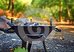 Barbecue grill with fire on nature, outdoor, close up