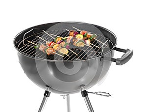 Barbecue grill with meat and vegetables on skewers, isolated on white