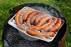 Barbecue grill with sausages on the grill