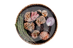 Barbecue Grilled lamb loin chops steaks, saddle in a plate with herbs. Isolated on white background.