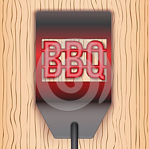 Barbecue hot metal spatula on wooden background