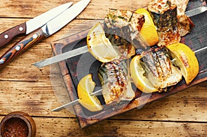 Barbecue mackerel fish on skewers