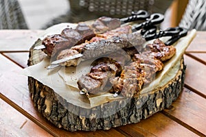 Barbecue meat. Grilled pork skewers on plate. selective focus