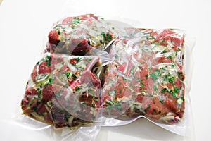 Barbecue meat in vacuum marinade bag