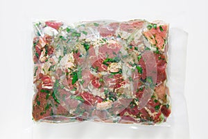 Barbecue meat in vacuum marinade bag