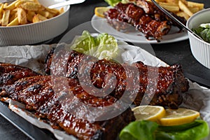Barbecue pork meal with fresh grilled spareribs, homemade french fries and salad