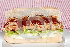 Barbecue pork riblet with sauce on bun