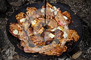 Barbecue with pork and sheep butter