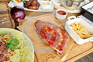 Barbecue pork spare rib. Grilled pork baby ribs with spicy bbq sauce. Barbecue restaurant menu. Many different food on