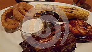Barbecue Ribs, Chicken And Corn Dinner with Onion Rings