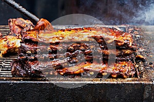 Barbecue Ribs and Chicken on the Grill at a Summer Festival photo