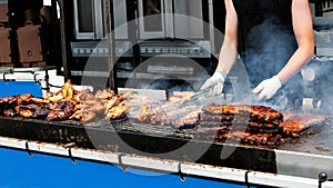 Barbecue Ribs and Chicken on the Grill at a Summer Festival photo