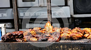 Barbecue Ribs and Chicken on the Grill at a Summer Festival photo