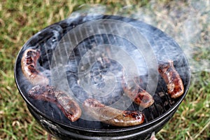 Barbecue sausages on the grill.