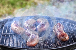 Barbecue sausages on the grill.