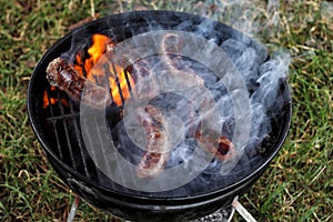 Barbecue sausages on the grill.