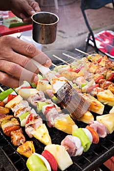 Barbecue stick grilling. Street food in Thailand. Meal and easy