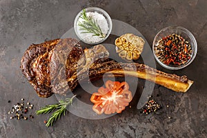 Barbecue Tomahawk Steak on grill roast with herb prepared for grill photo