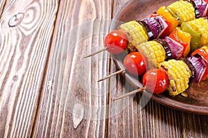 Barbecue with vegetable skewers