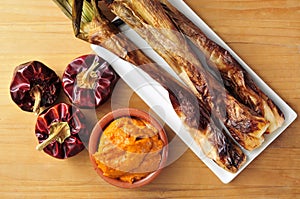 Barbecued calcots, sweet onions, and romesco sauce typical of Ca