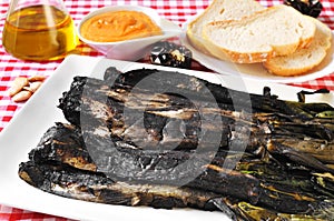 Barbecued calcots, sweet onions, and romesco sauce typical of Ca