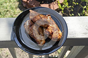 Barbecued Chicken Off The Grill On Plate Out Doors