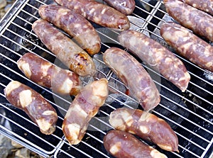 Barbecued meat and pork sausages