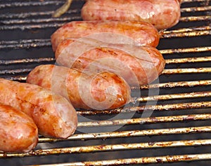 Barbecued meat and pork sausages