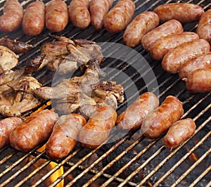 Barbecued meat and pork sausages