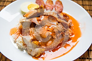 Barbecued red pork and crispy pork in sauce with rice