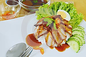 Barbecued red pork in sauce with rice