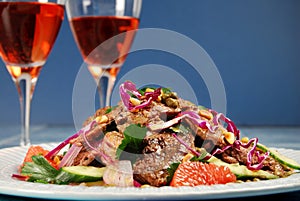 Barbecued steak salad and wine