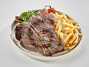 Barbecued T-bone steak with pommes de frites photo