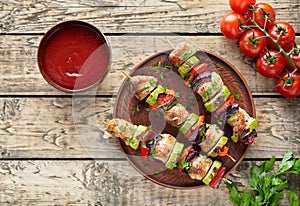 Barbecued turkey or chicken meat shish kebab skewers with ketchup