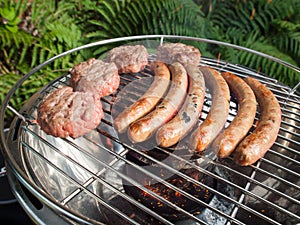 Barbecueing sausages and beefburgers