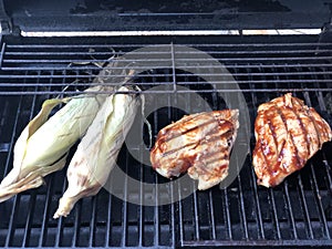 Barbecuing corn an chicken