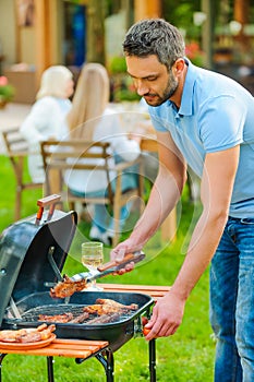 Barbecuing meat to perfection. photo