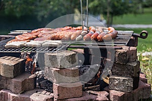 Barbecuing on outdoor grill grate - BBQ