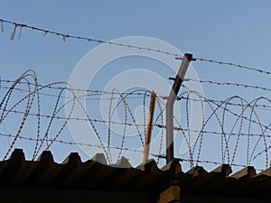 Barbed wire against the sky