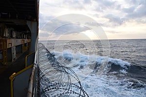 Barbed wire attached to the ship hull to protect the crew against piracy attack in the Gulf of Guinea in West Africa.