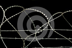 Barbed wire on black background