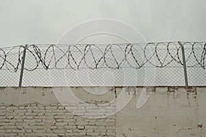 barbed wire on a concrete wall