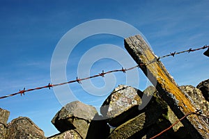 Barbed wire and a dry-stone wall photo