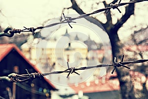 Barbed wire fence in old town Banska Stiavnica, Slovakia, retro