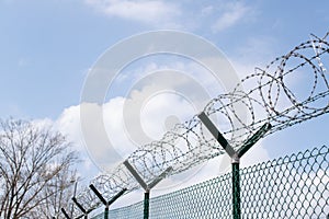 Barbed wire fence outside felony prison freedom stop trespassing security