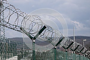 Barbed wire fence outside felony prison freedom stop trespassing security