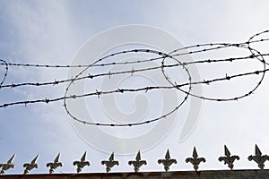 Barbed wire fence silhouette with sky